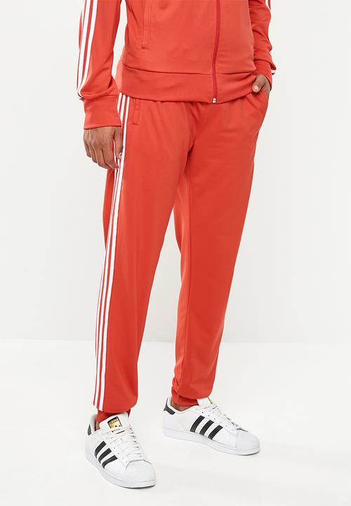 red adidas track pants