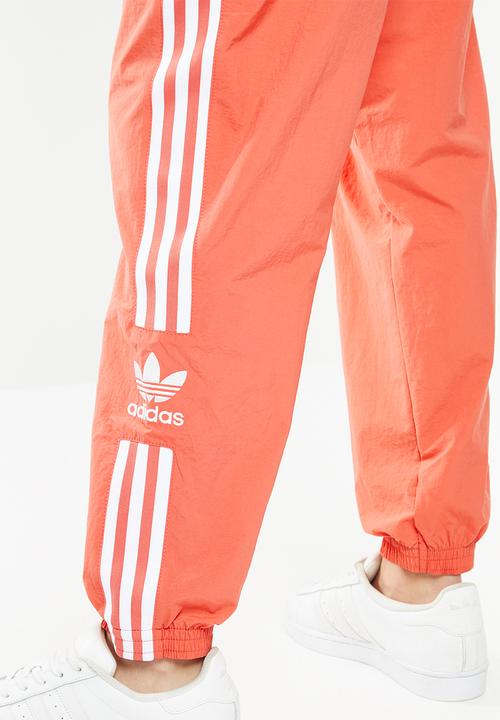 adidas Originals - Adicolour lock up track pants - orange & white