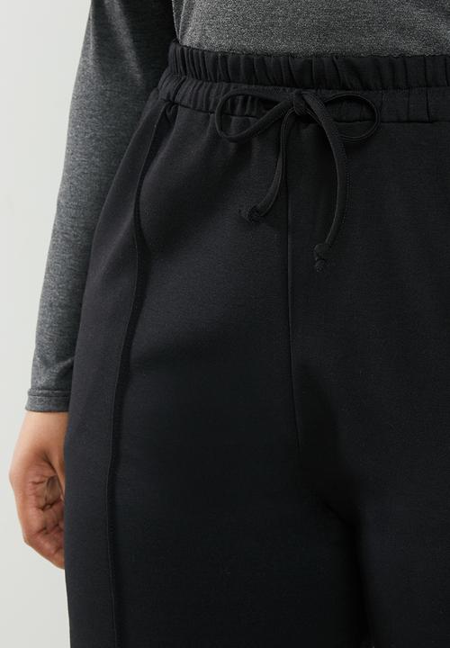 edit Plus - Knit peg leg trouser - black