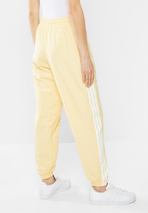 adidas Originals - Adicolour lock up track pants - yellow
