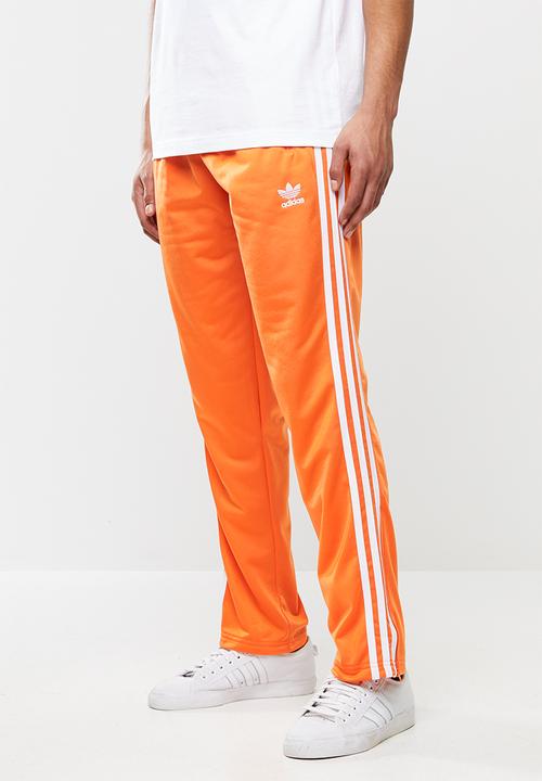 adidas firebird track pants orange