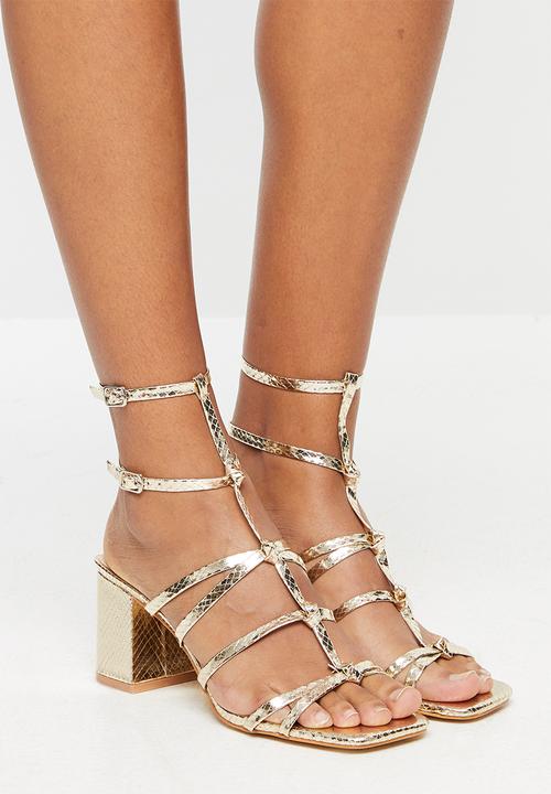 gold low block heels
