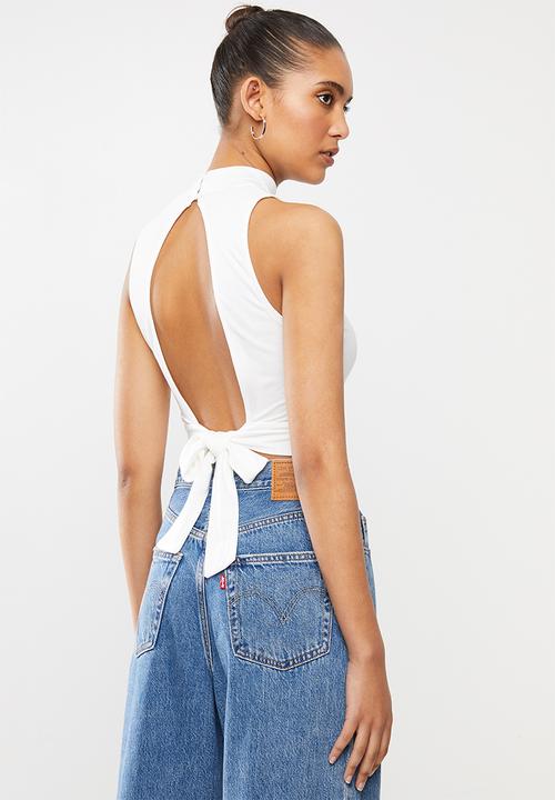 Blake -  Turtle neck sleeveless tie back detail crop top