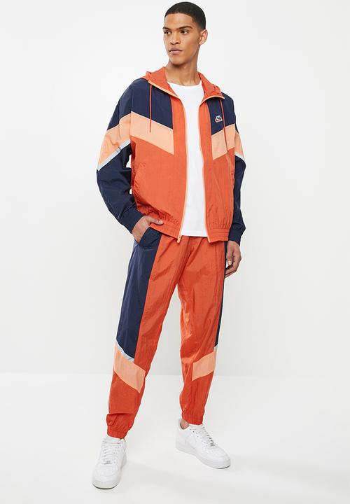 Nike - Nike sportswear he wr+ unld woven pants - orange & navy