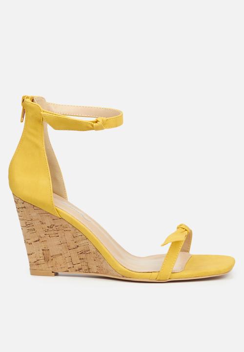 yellow and black heels