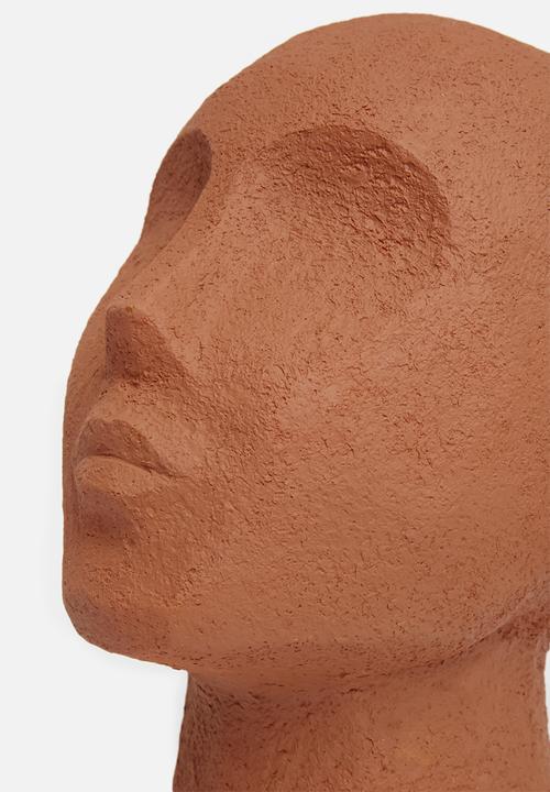 Present Time - Statue face art up - terracotta orange