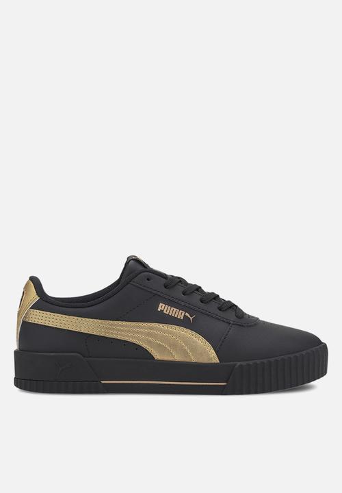 gold and black puma sneakers