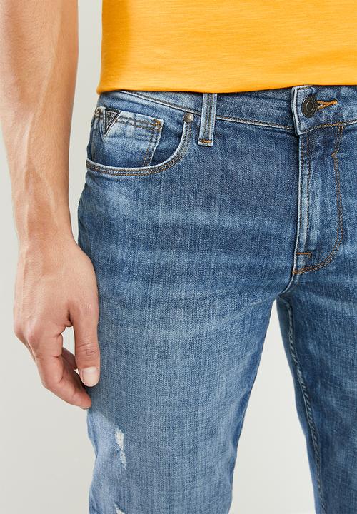 GUESS - Mid wash slim taper with rips - mid blue