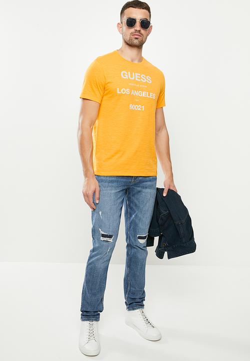 GUESS - Mid wash slim taper with rips - mid blue