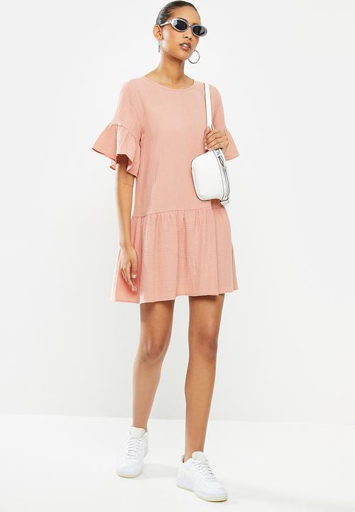 Blake - Dropped waist mini dress with ruffle sleeve - pale rose