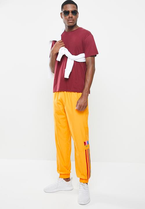 adidas Originals - 3D 3 stripe trackpants - gold