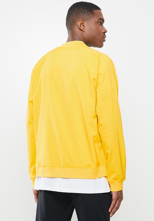 Under Armour - Undrtd woven warmup jacket - yellow 