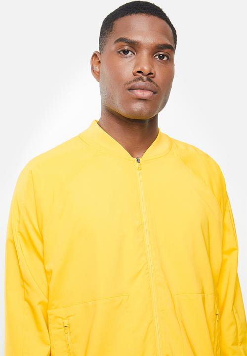 Under Armour - Undrtd woven warmup jacket - yellow 