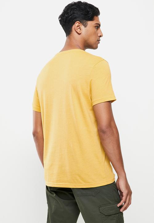 Lee  - American denim brand - yellow