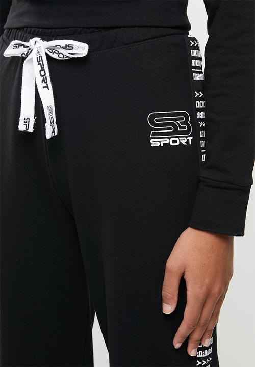 SISSY BOY - Flared sweatpants - black