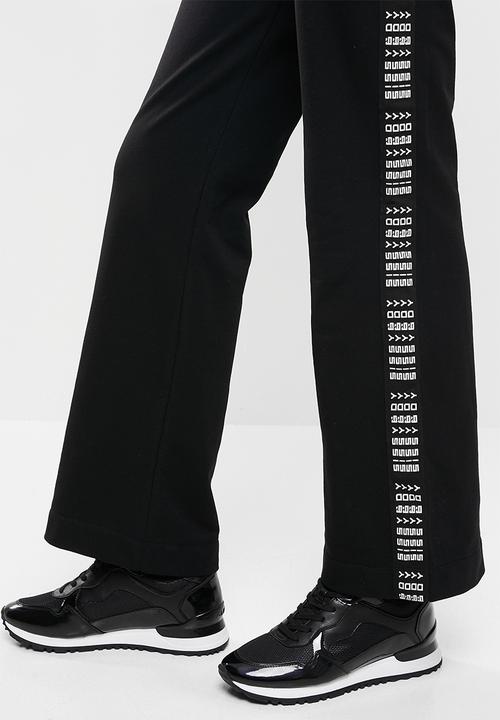 SISSY BOY - Flared sweatpants - black