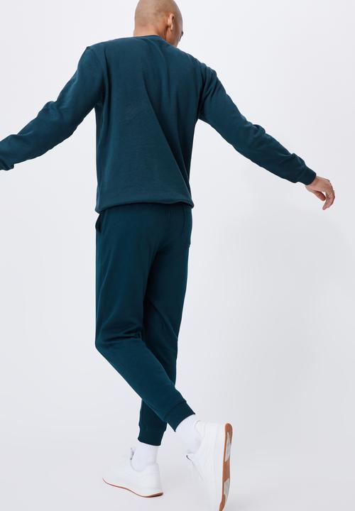 Cotton On - Trippy slim trackie - deep sea teal