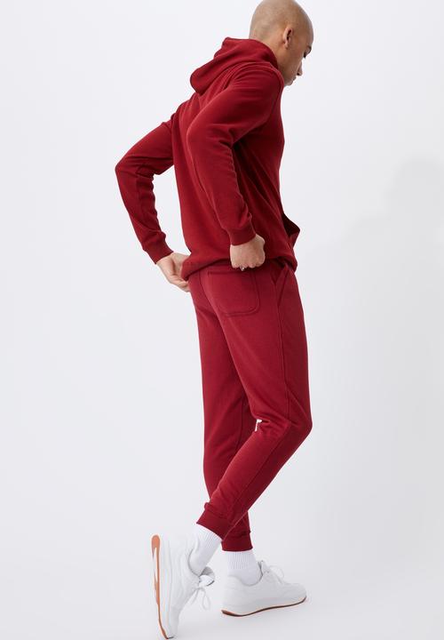 Cotton On - Trippy slim trackie - sundried red