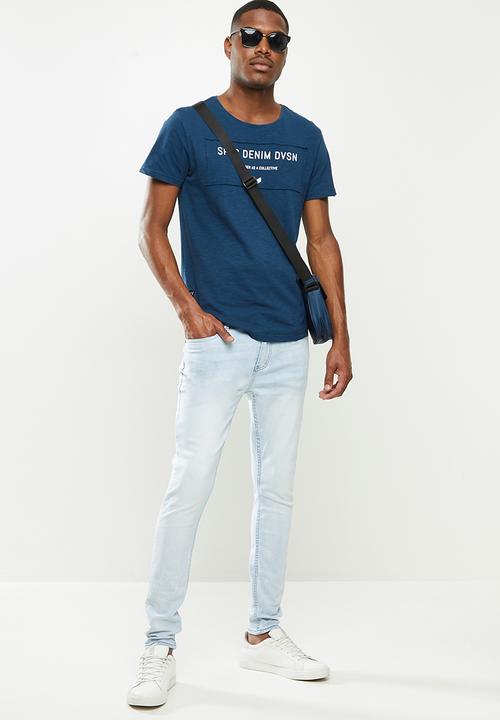 S.P.C.C - Ice Blue Jeans Signature Trench Fit Jeans - Bleach