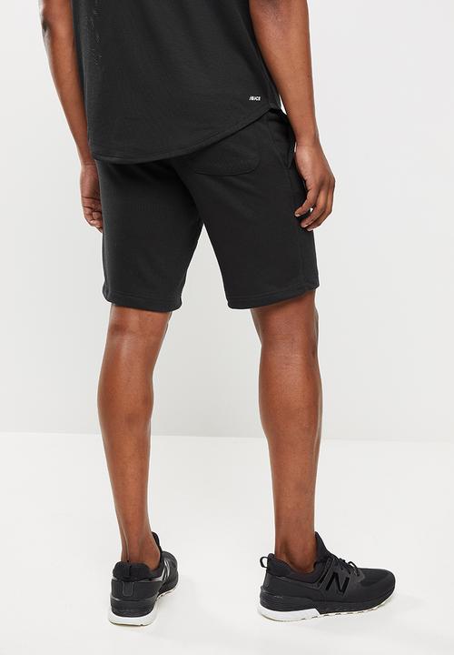 New Balance  - New Balance  essentials stacked logo short - black