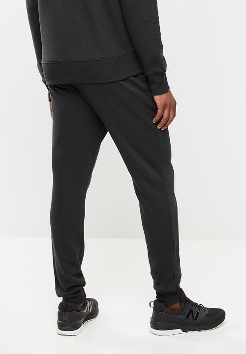 New Balance  - New Balance  classics core pant - black