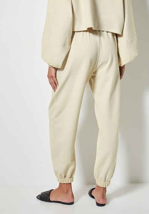 VELVET - Slouch fleece tapered leg track pant - cream