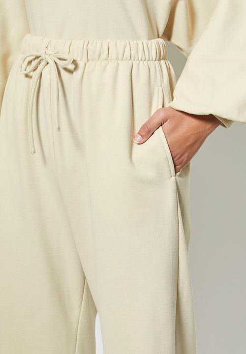 VELVET - Slouch fleece tapered leg track pant - cream