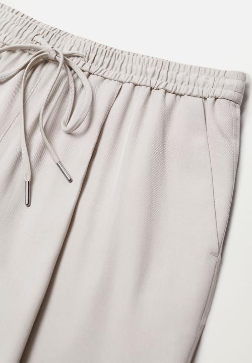 MANGO - Trousers fluido - natural