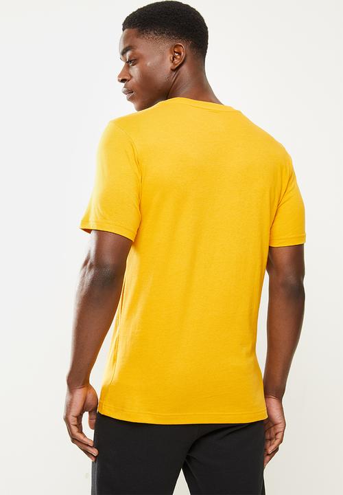 New Balance  - Nb classics core tee - varsity gold
