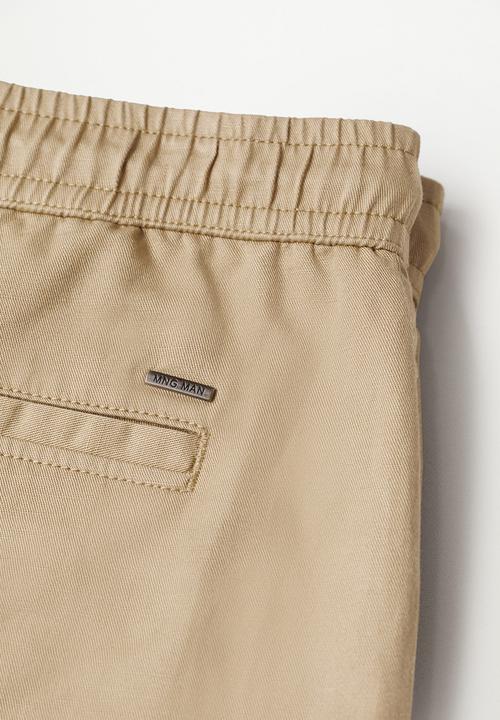 MANGO - Bermuda shorts flek - light beige