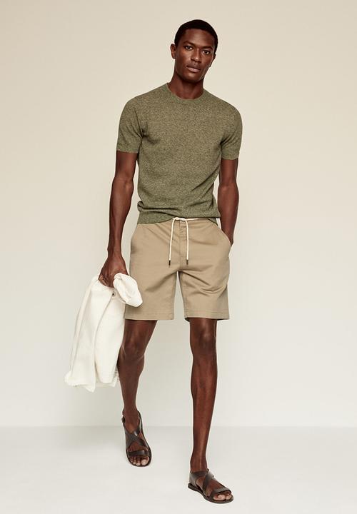 MANGO - Bermuda shorts flek - light beige