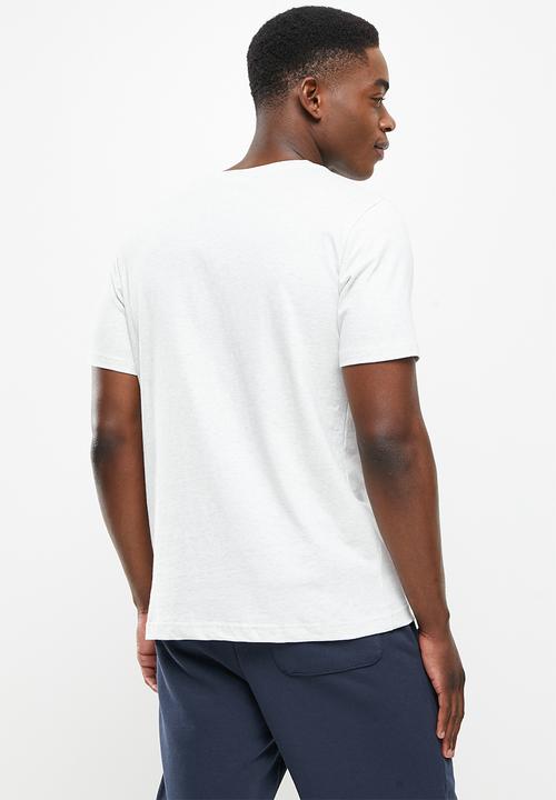 New Balance  - Nb athletics higher learning logo tee - sea salt heather
