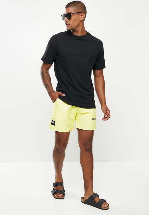 Butan - Aluta block letters shorts - pastel yellow