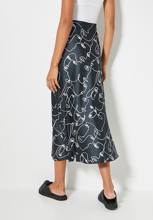 Superbalist - Long midi slip skirt - dark ground doodle faces