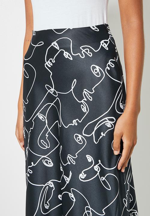 Superbalist - Long midi slip skirt - dark ground doodle faces