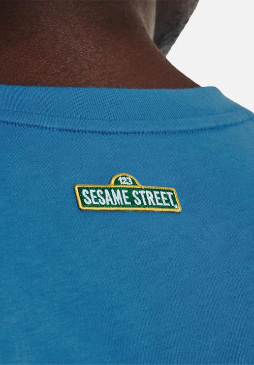 Under Armour - Curry X Sesame Street Hint of Cookie Tee- Mid-Blue