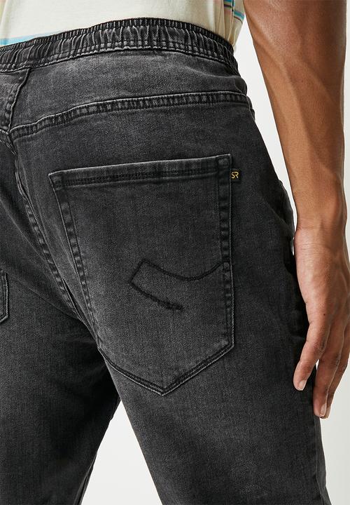 STYLE REPUBLIC - Gabe tapered fit cuffed jeans - washed black