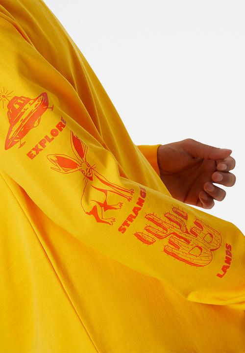New Balance  - NB All Terrain Long Sleeve Tee- Sunflower