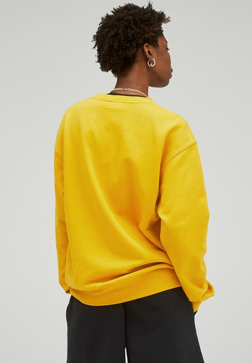 New Balance  - Uni-ssentials french terry crewneck sweatshirt - varsity gold