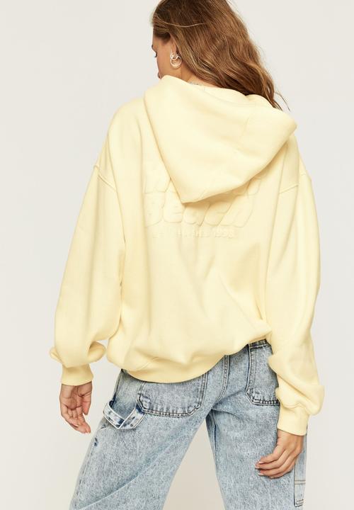 Supré  - Paige oversized printed hoodie - lemon chiffon miami beach