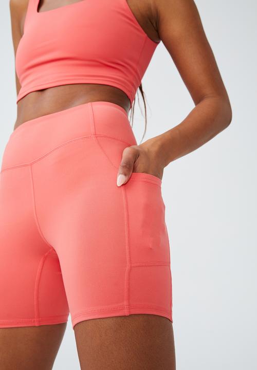 Cotton On - Ultra soft booty lift pocket bike short - coral burst