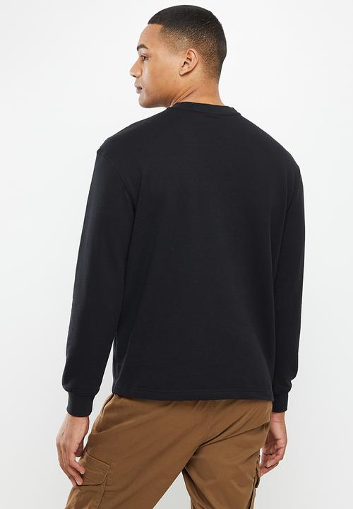 Jonathan D - James  long sleeve crewneck sweater with front print - black