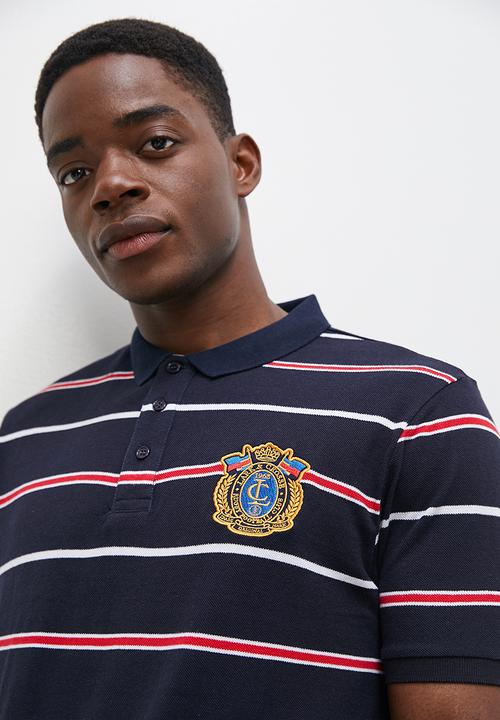 Lark & Crosse - Wide striped logo golfer navy & red