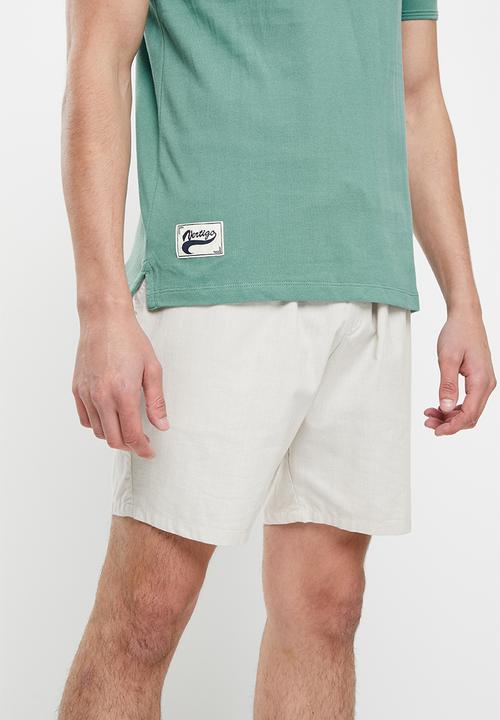 Vertigo - Vertigo running stitch embroidery golfer - mineral blue