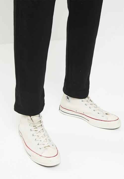 THE UNBRANDED BRAND - Relaxed tapered fit 11 oz solid black stretch selvedge denim