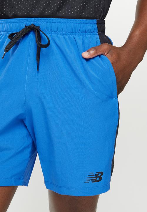 New Balance  - Tenacity 7in woven short graphic - blue