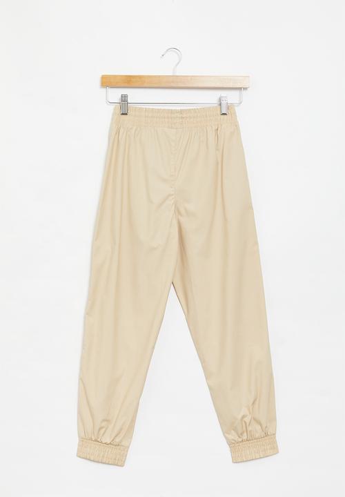 PUMA - Za boys chino pants - light sand