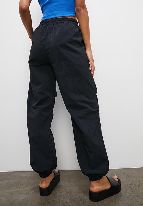Blake - Parachute trousers - black