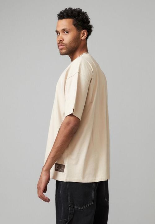 Cotton On - Oversized nfl T-shirt - lcn nfl beige/raiders neck rib