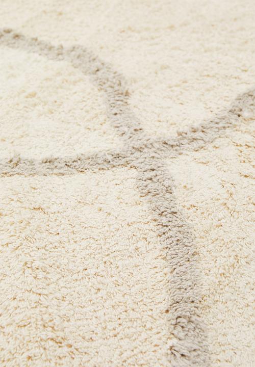 Sixth Floor - Linear tufted round rug - natural